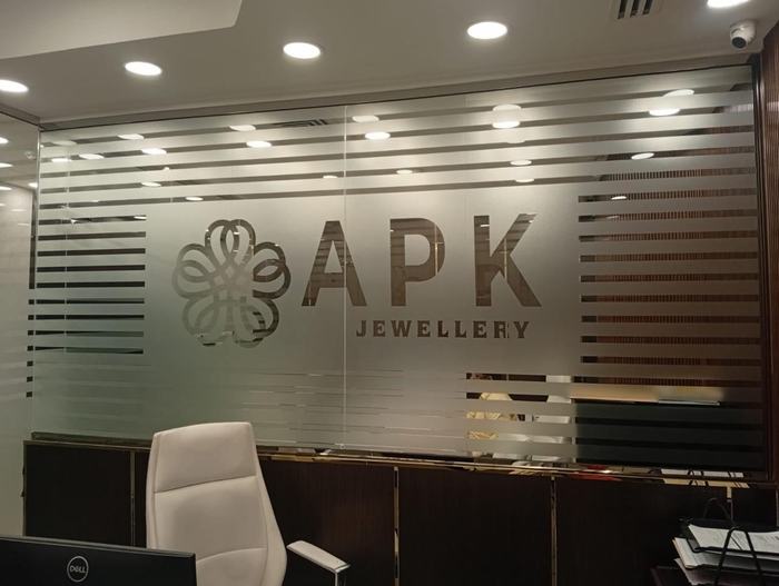 APK Jewellery frosted glass logo in an office