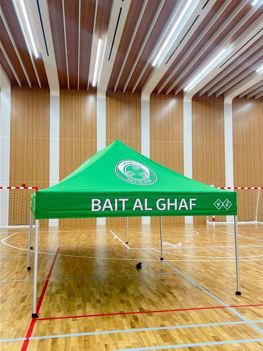 Bait Al Ghaf branded canopy tent at an indoor sports venue