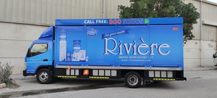 Rivière mineral water truck box branding