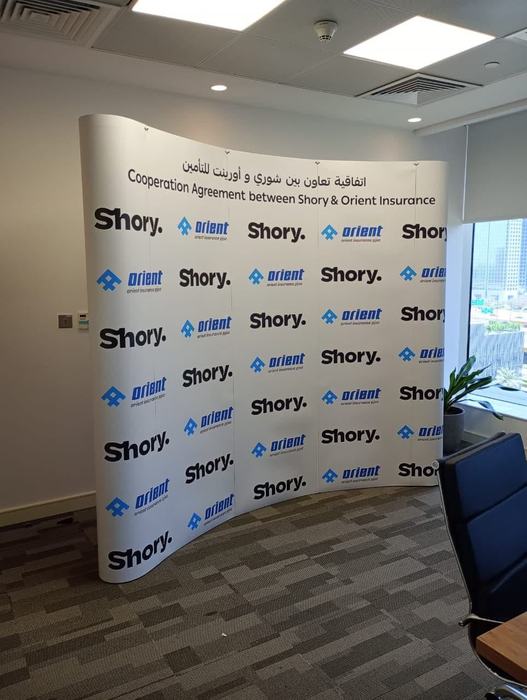 Shory and Orient Insurance step and repeat backdrop