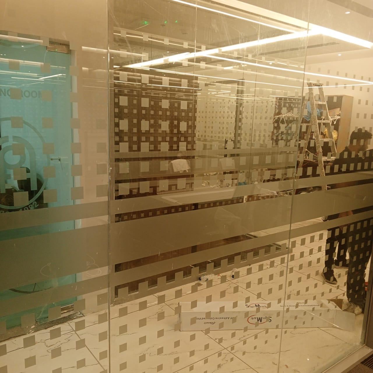 Patterned frosted glass film on office partitions in Dubai
