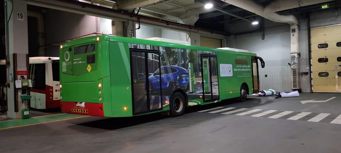 Green bus side advertising wrap
