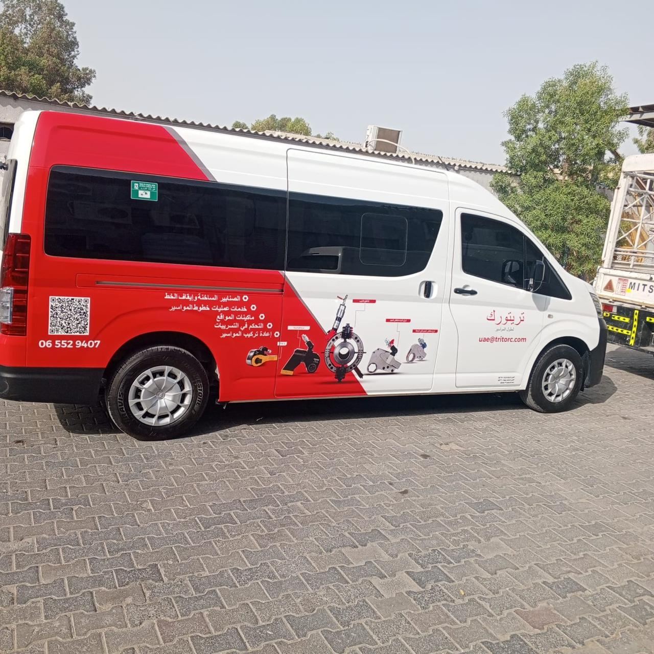 Toyota Hiace passenger van branding in red and white