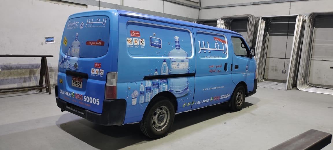 Rivière mineral water delivery van branding