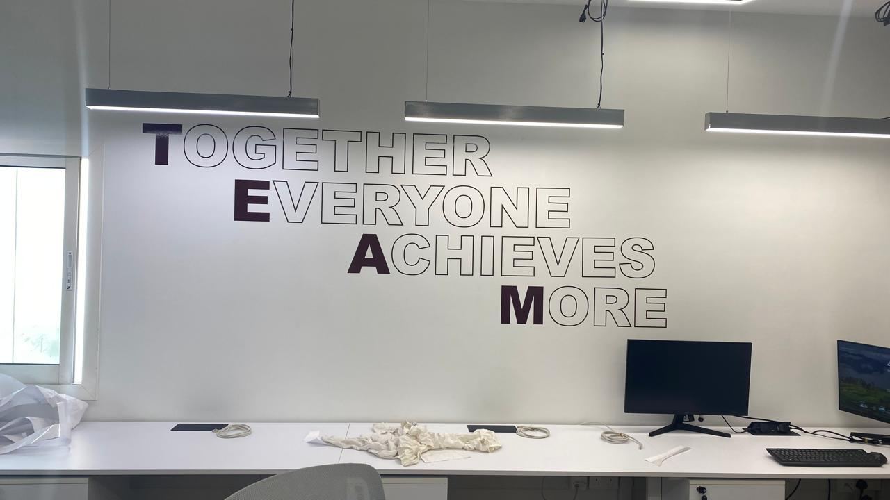 Together Everyone Achieves More office wall lettering