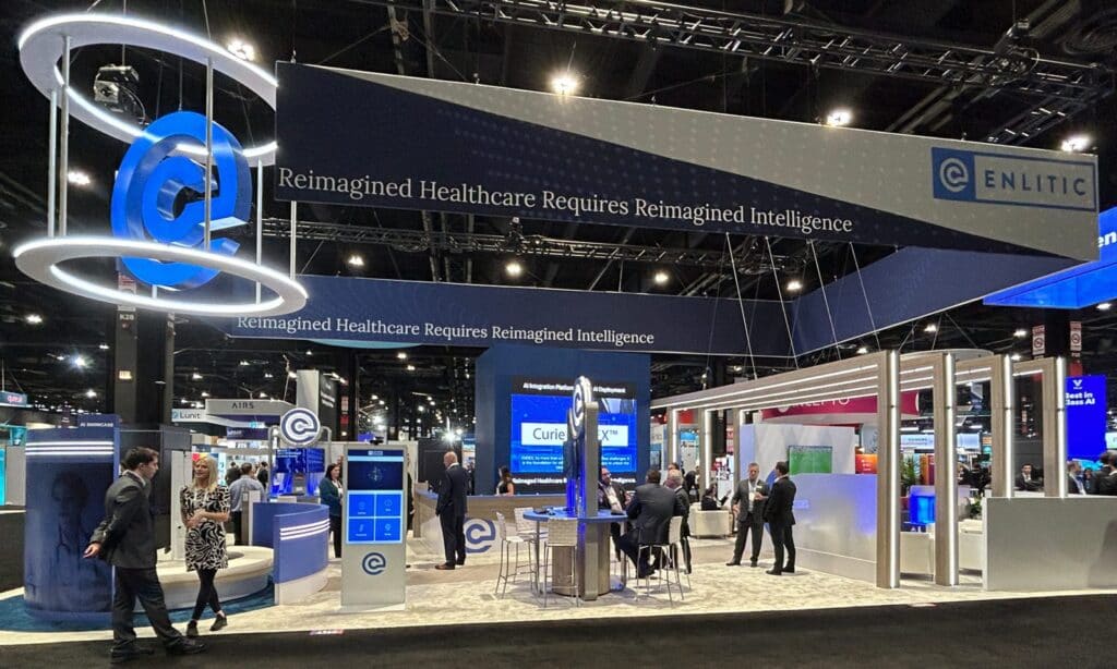 Exhibition stand with an overhead hanging banner