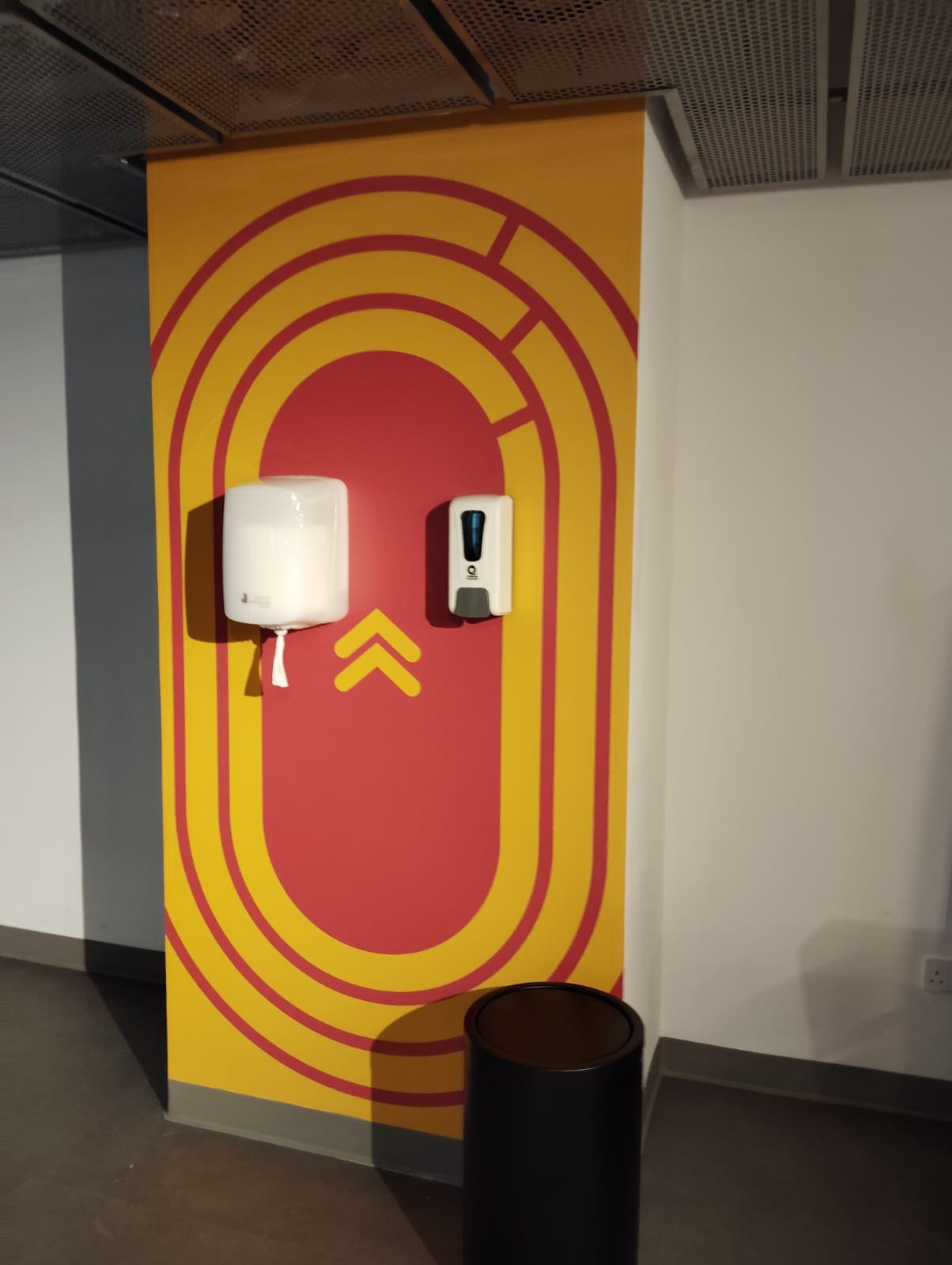 Running track wall graphic in a fitness space